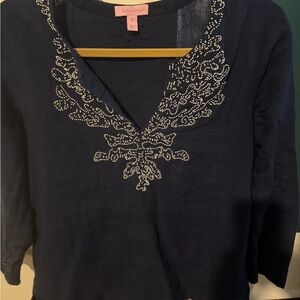 Navy with white beads. Size medium.